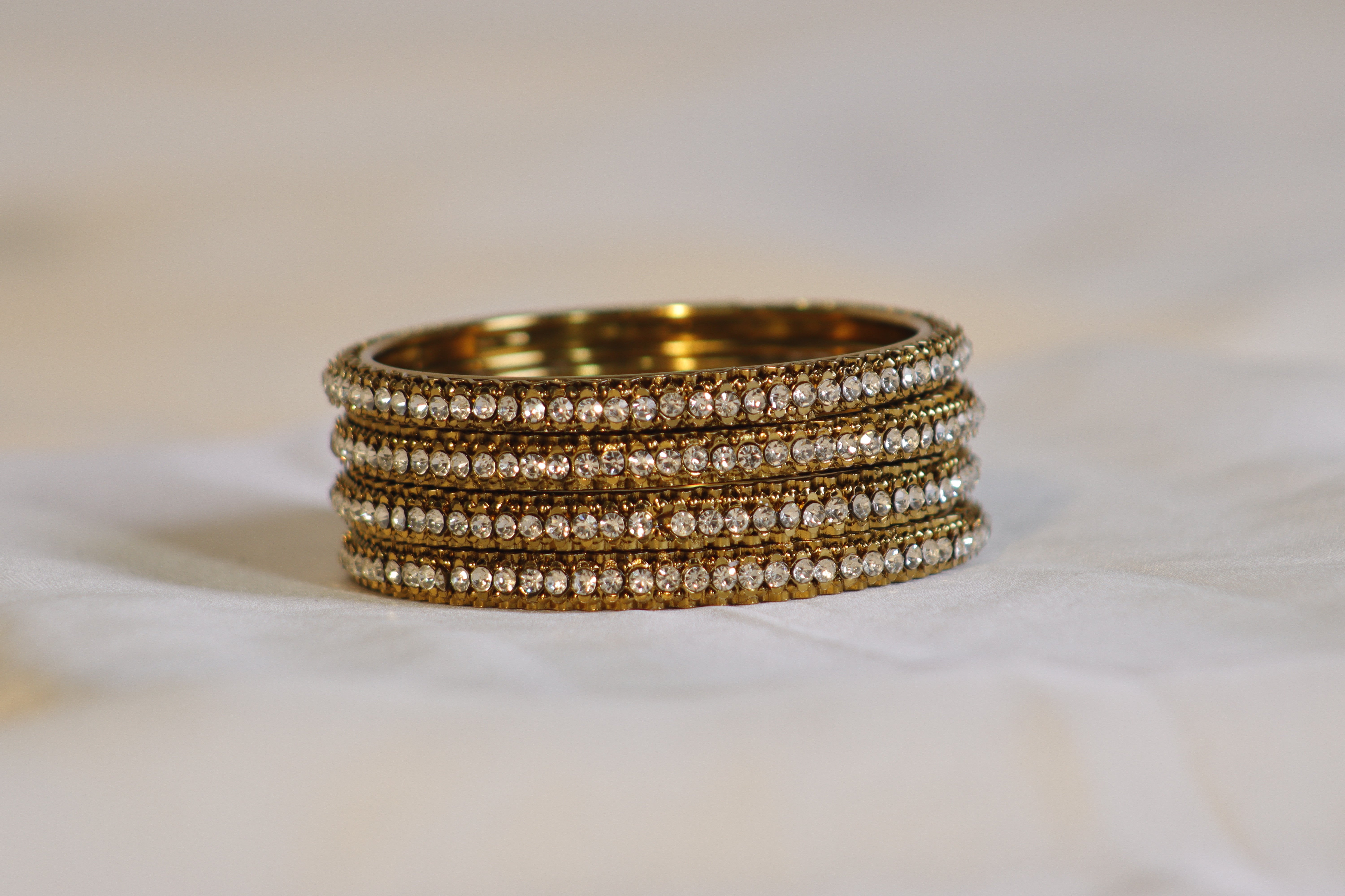 Golden Kara Set of 4 with White Stones – Elegant & Classic Look