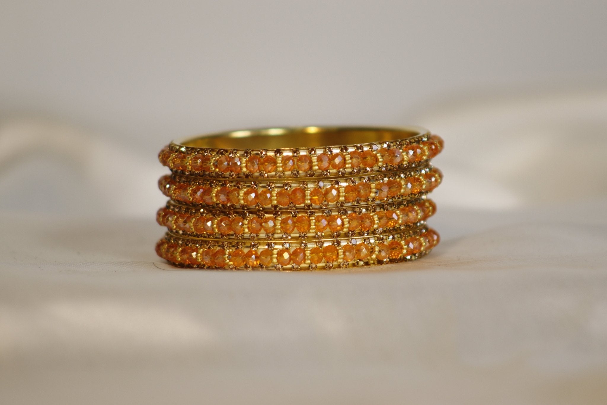 Metal Bangles with Orange Stones – Set of 4